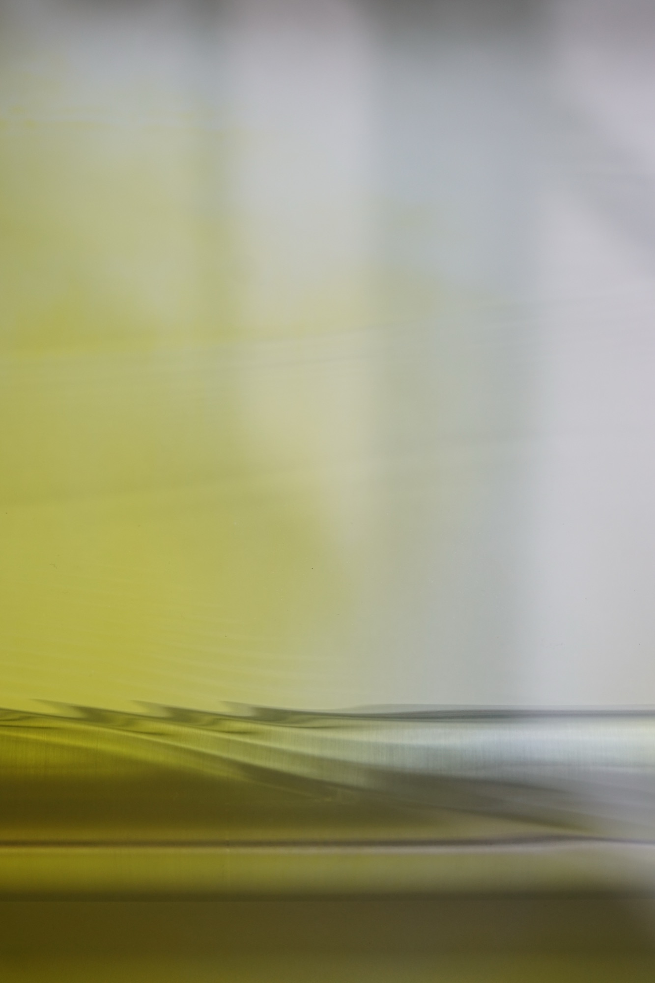 wave chamber — liquid-filled glass pane with shifting color gradients